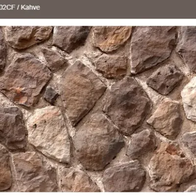 Geleneksel taş estetiğini yansıtan, toprak tonlu duvar taşı.